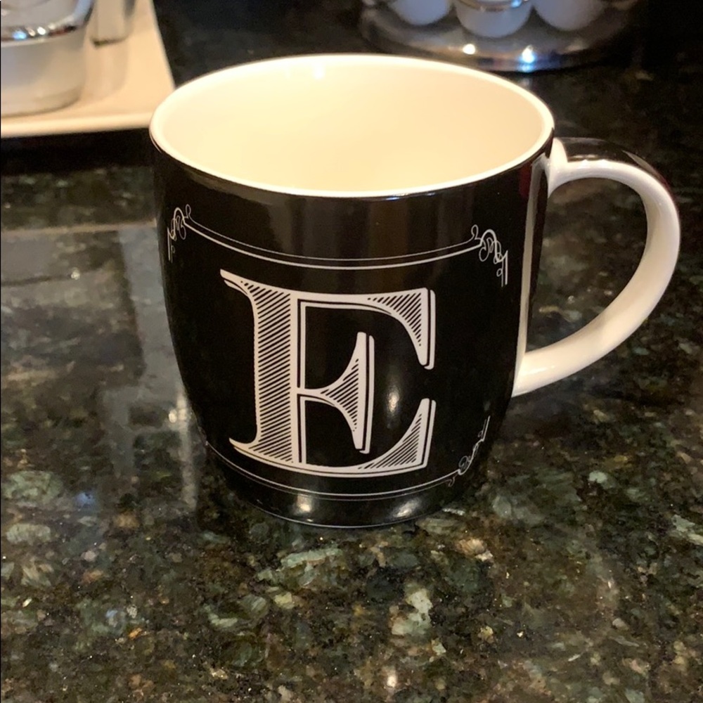 Small black and white “E” initial mug
